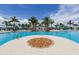 Large resort-style pool with fire pit and lounge chairs at 10792 Tarflower Dr # 202, Venice, FL 34293