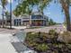 Modern shops and a park-like setting with benches at 10792 Tarflower Dr # 202, Venice, FL 34293