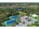 Tennis courts and a large parking area in community at 11409 Okaloosa Dr, Venice, FL 34293
