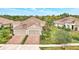 Luxury home with three-car garage and beautiful landscaping at 11409 Okaloosa Dr, Venice, FL 34293