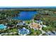 Aerial view of community pool, playground, and lake at 11409 Okaloosa Dr, Venice, FL 34293