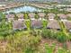 Aerial view of luxury homes and lake at 11409 Okaloosa Dr, Venice, FL 34293