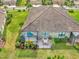 Home with screened lanai and lush landscaping at 11409 Okaloosa Dr, Venice, FL 34293