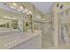 Double vanity bathroom with a walk-in shower at 11409 Okaloosa Dr, Venice, FL 34293