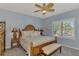 Spacious bedroom with a king-size bed and coastal decor at 11409 Okaloosa Dr, Venice, FL 34293