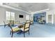 Relaxing community room with seating areas and built-in shelving at 11409 Okaloosa Dr, Venice, FL 34293
