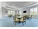 Community gathering space with multiple tables and chairs at 11409 Okaloosa Dr, Venice, FL 34293
