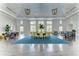 Bright and spacious community room with seating areas and large windows at 11409 Okaloosa Dr, Venice, FL 34293