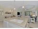Kitchen island with double sink, looking toward living room at 11409 Okaloosa Dr, Venice, FL 34293