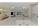 Kitchen island with double sink, looking toward living room at 11409 Okaloosa Dr, Venice, FL 34293