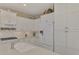Bright kitchen with white cabinets, granite countertops, and stainless steel appliances at 11409 Okaloosa Dr, Venice, FL 34293