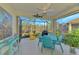 Relaxing screened lanai with outdoor furniture and a view of the backyard at 11409 Okaloosa Dr, Venice, FL 34293
