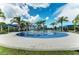 Community spray park with shaded seating and playground nearby at 11409 Okaloosa Dr, Venice, FL 34293