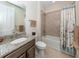 Guest bathroom with a tub, toilet, and vanity with granite top at 11945 Lovegrass St, Venice, FL 34293