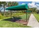 Bocce ball court with covered seating and benches at 11945 Lovegrass St, Venice, FL 34293