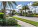 Gated community entrance with palm trees and landscaping at 11945 Lovegrass St, Venice, FL 34293