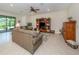 Spacious living room with comfortable sofas and built-in shelving at 11945 Lovegrass St, Venice, FL 34293