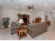 Comfortable living room, two sofas, built-in shelving and a large TV at 11945 Lovegrass St, Venice, FL 34293