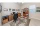 Home office with a desk, computer, and ample shelving for storage at 11945 Lovegrass St, Venice, FL 34293