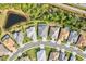 Bird's-eye view of a residential street with lake access at 12460 Davie Ct, Venice, FL 34293