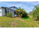 Landscaped backyard with pool and patio, offering privacy and tranquility at 12460 Davie Ct, Venice, FL 34293