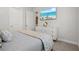 Bedroom with a king-size bed and large TV at 12460 Davie Ct, Venice, FL 34293