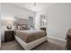 Guest bedroom with a full-size bed and en-suite bath at 12460 Davie Ct, Venice, FL 34293