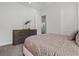 Bedroom with a full-size bed and modern dresser at 12460 Davie Ct, Venice, FL 34293
