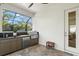 Outdoor kitchen features a grill, sink, and mini-fridge at 12460 Davie Ct, Venice, FL 34293
