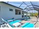 Relaxing view of the screened pool and spa at 12460 Davie Ct, Venice, FL 34293