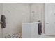 Large walk-in shower with marble tile and a modern design at 12460 Davie Ct, Venice, FL 34293