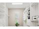 Spacious walk-in closet with built-in shelving and drawers at 12460 Davie Ct, Venice, FL 34293