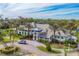 Community clubhouse with pool and landscaping at 12488 Palatka Dr, Venice, FL 34293