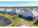 Aerial view of a community with lakefront homes at 12488 Palatka Dr, Venice, FL 34293