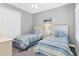Bedroom with twin beds, and beach themed decor at 12488 Palatka Dr, Venice, FL 34293