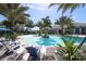 Community pool with lounge chairs at 12488 Palatka Dr, Venice, FL 34293
