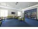 Community room with library and seating at 12488 Palatka Dr, Venice, FL 34293