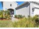 Front entry and walkway with landscaping at 12488 Palatka Dr, Venice, FL 34293