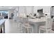 Modern kitchen featuring a large island and white cabinetry at 12488 Palatka Dr, Venice, FL 34293