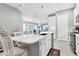 Bright kitchen with an island, stainless steel appliances, and white cabinets at 12488 Palatka Dr, Venice, FL 34293