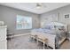 Large main bedroom with king-size bed and neutral decor at 12488 Palatka Dr, Venice, FL 34293