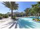 Community pool with a clubhouse and landscaping at 12488 Palatka Dr, Venice, FL 34293