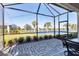 Spacious screened patio overlooking lake at 12488 Palatka Dr, Venice, FL 34293