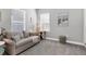 Cozy sitting room with comfortable sofa and neutral color scheme at 12488 Palatka Dr, Venice, FL 34293