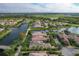 Luxury community with houses surrounding a lake and bridge at 13240 Guyana St, Venice, FL 34293