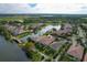 Luxury homes surround a lake with a bridge at 13240 Guyana St, Venice, FL 34293