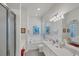 Spa-like bathroom with soaking tub, walk-in shower, and double vanity at 13240 Guyana St, Venice, FL 34293