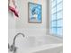 Relaxing bathroom with soaking tub and a large window at 13240 Guyana St, Venice, FL 34293