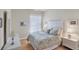 Cozy bedroom with a floral comforter and two bedside tables at 13240 Guyana St, Venice, FL 34293