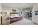 Main bedroom with king-size bed, private access to patio, and ample natural light at 13240 Guyana St, Venice, FL 34293
